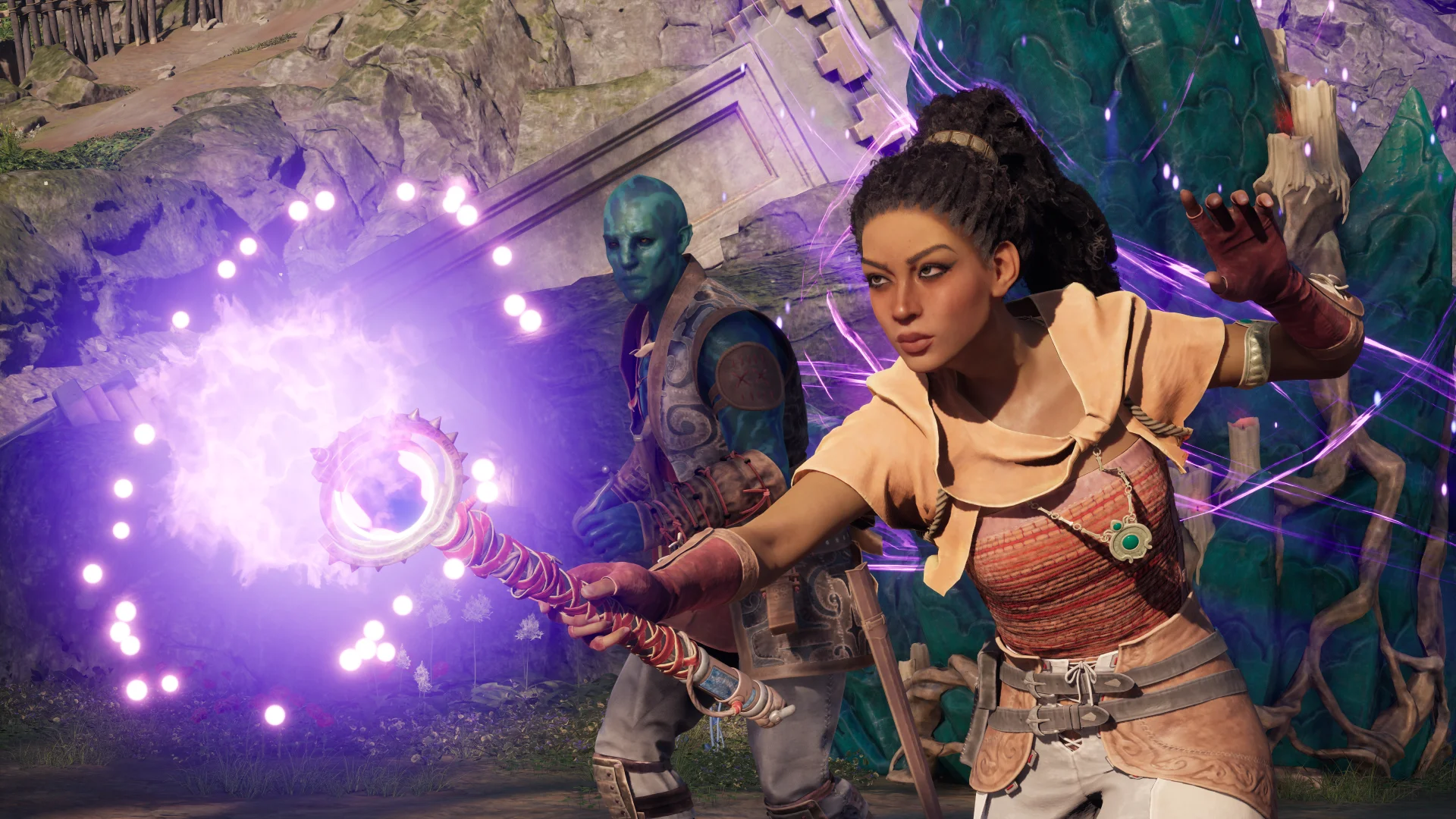 Avowed screenshot of a leather-clad mage wielding a glowing staff as a blue-skinned person looks on