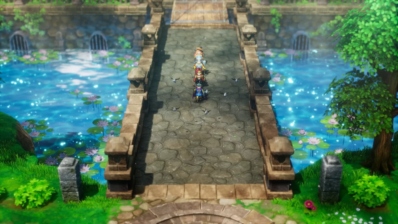 A screenshot of the party venturing over a bridge with water underneath in Dragon Quest III HD 2D Remake